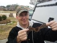Charles Parker holding  a bat without gloves